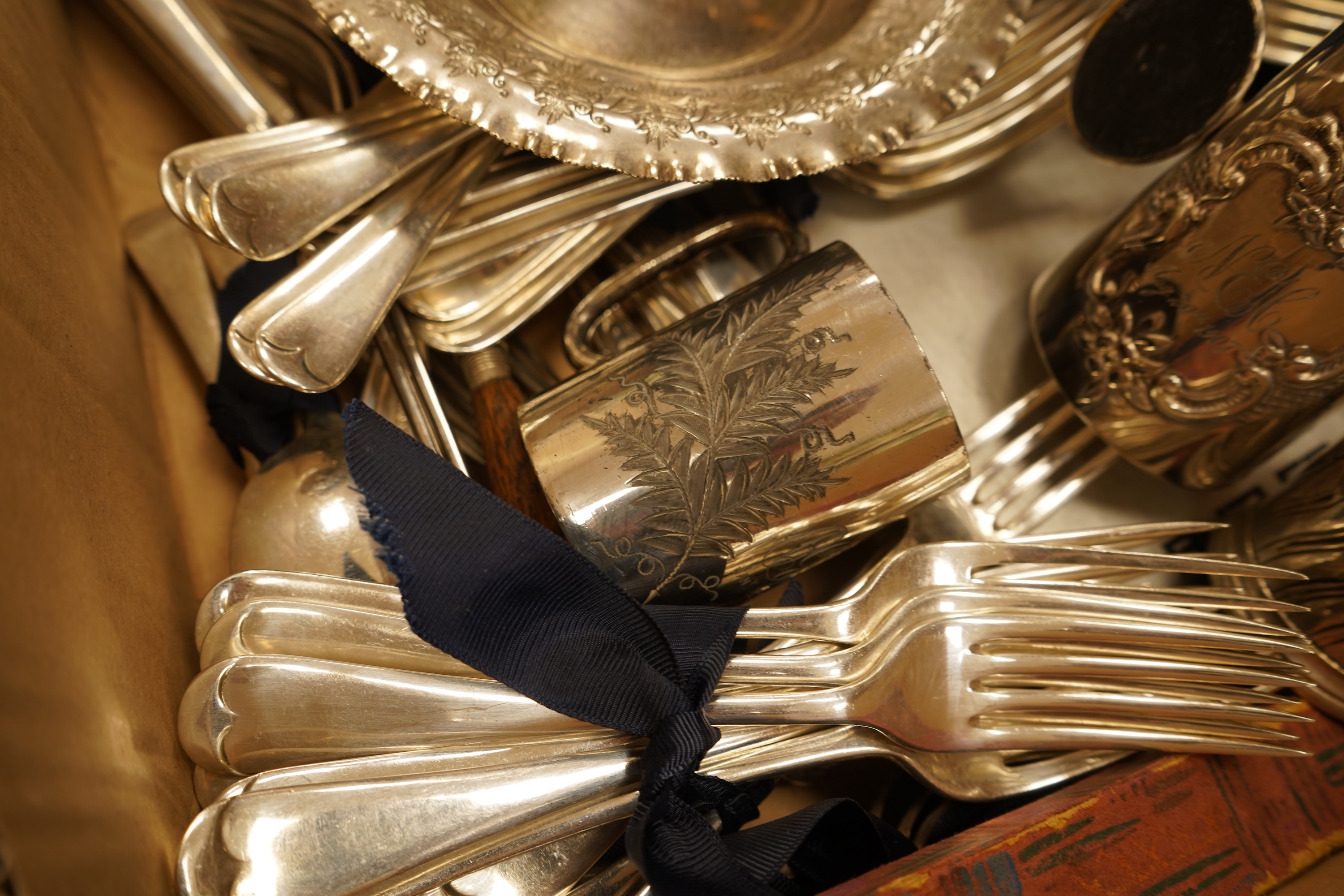 A quantity of assorted plated wares including a pair of 19th century wine coasters, antimony box, toast rack and flatware.